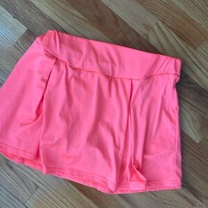 Skort for active wear.  It is between pink and salmon color.